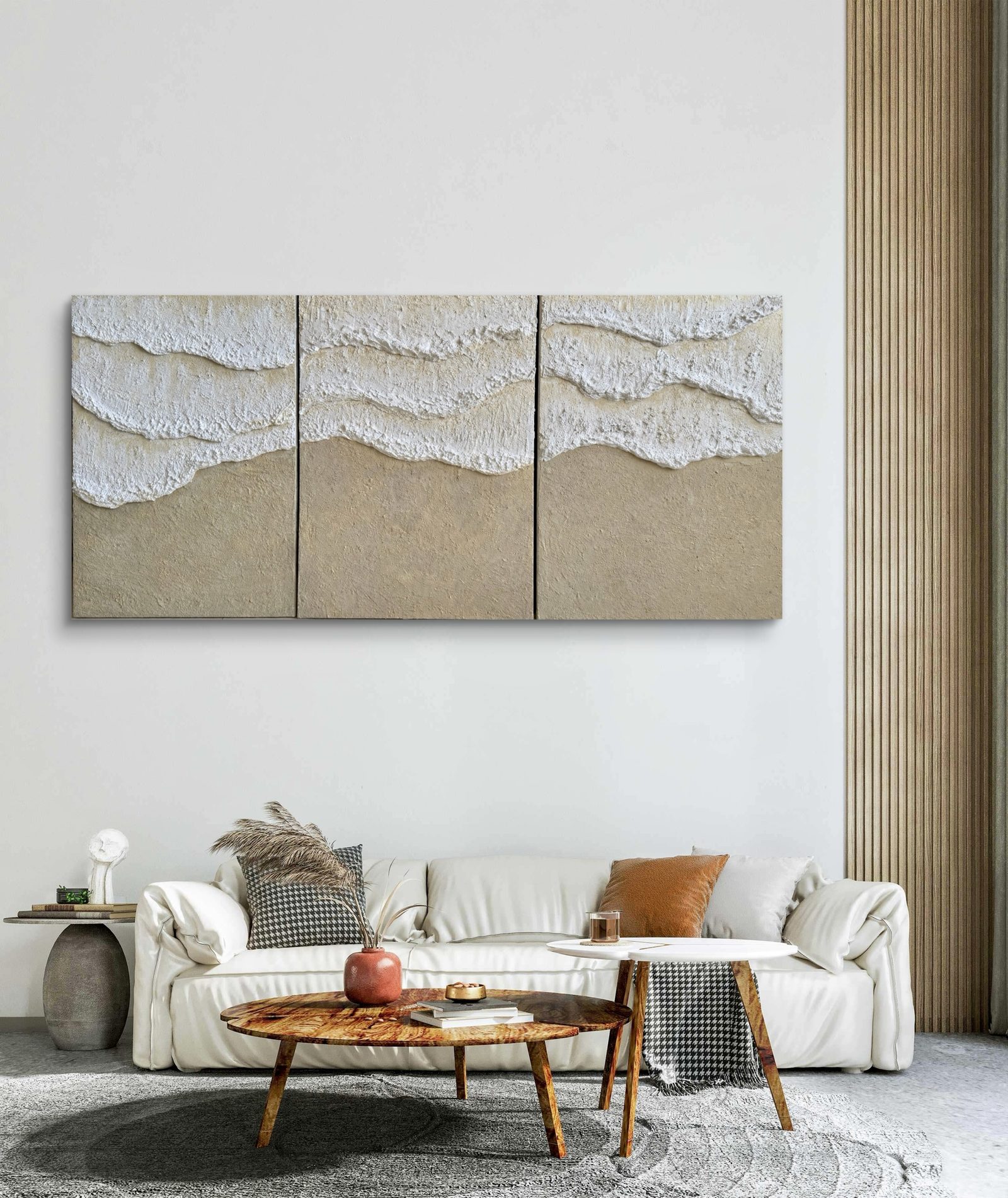 Three-panel wave relief installation above a sofa